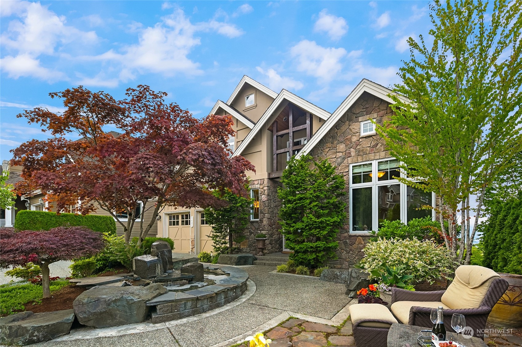 a front view of a house with garden