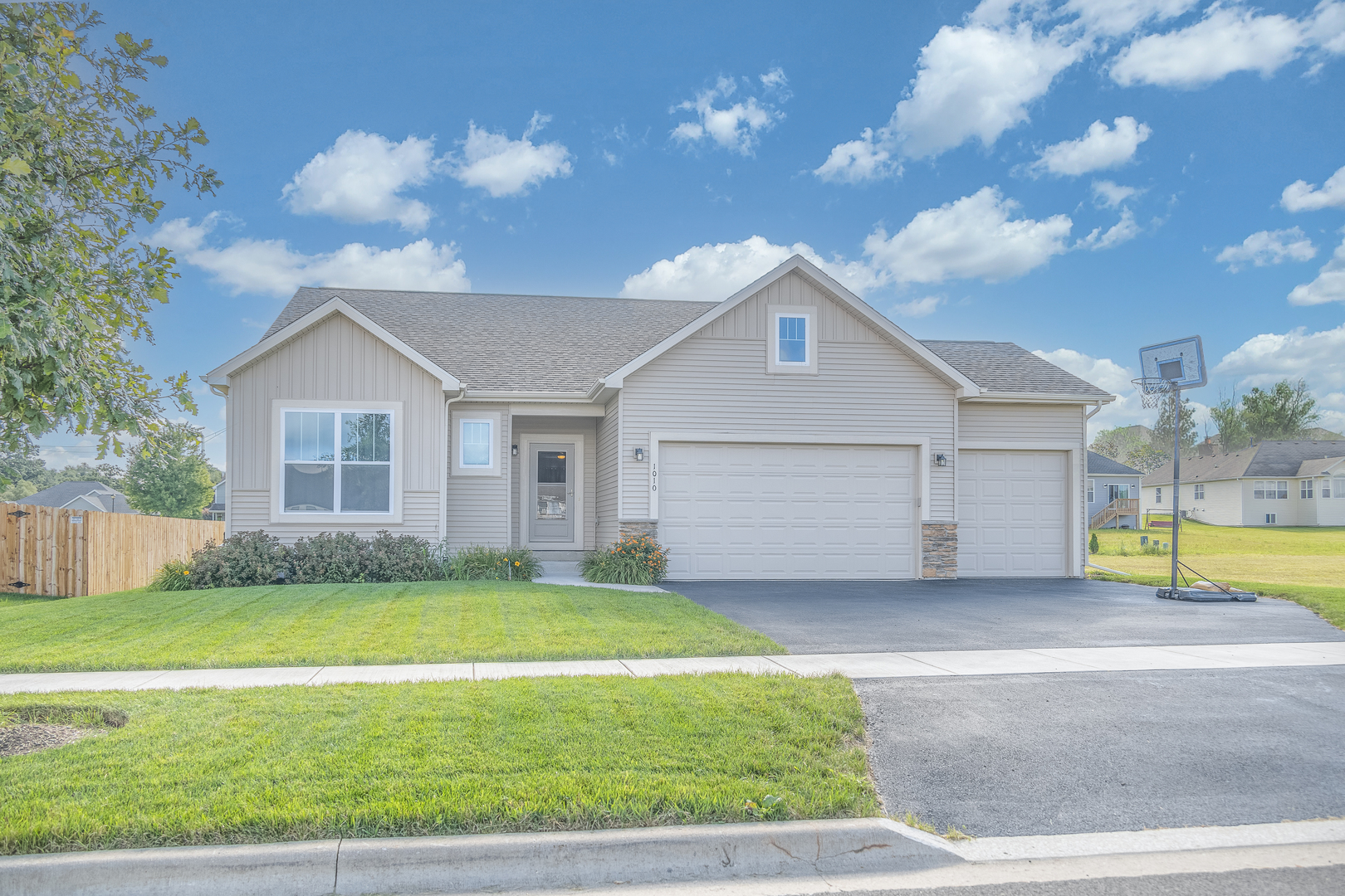 a view of a house with a yard and garage