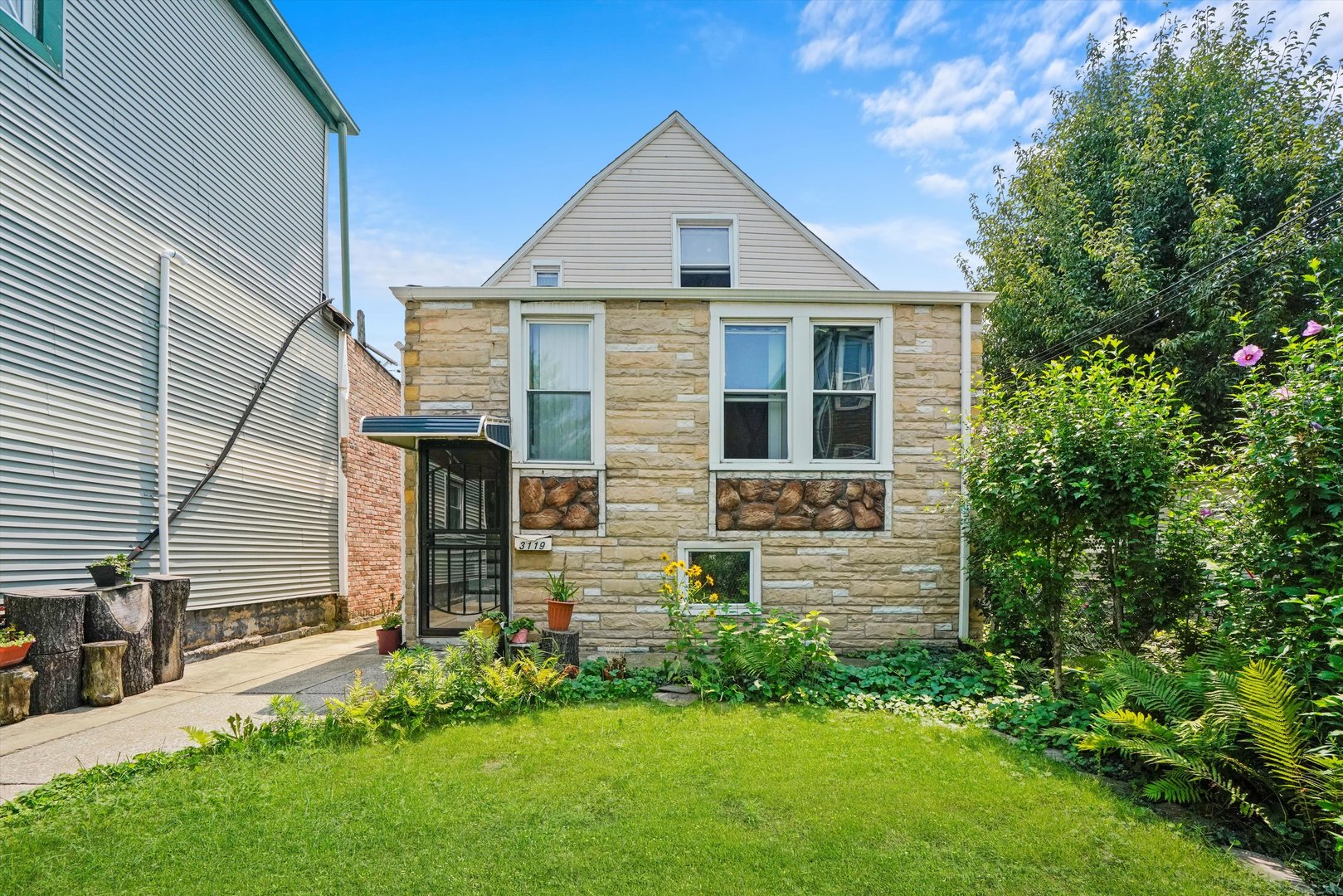 a front view of a house with a yard