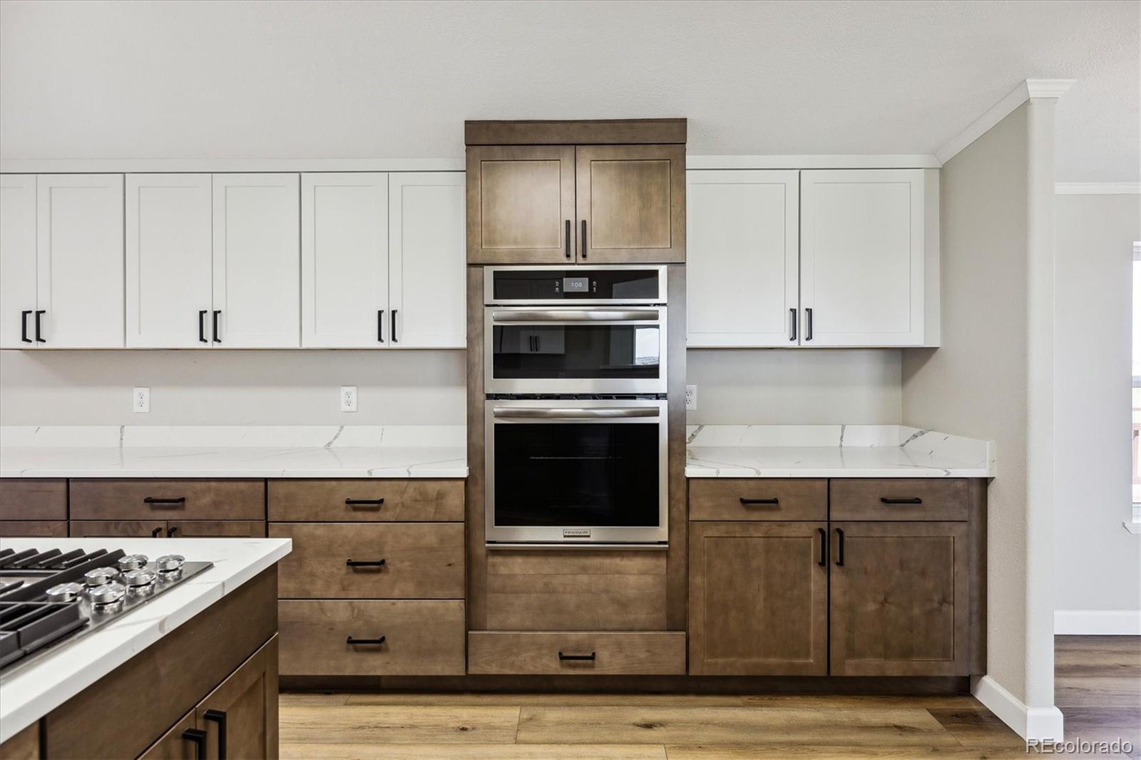 a kitchen with granite countertop a stove and a sink