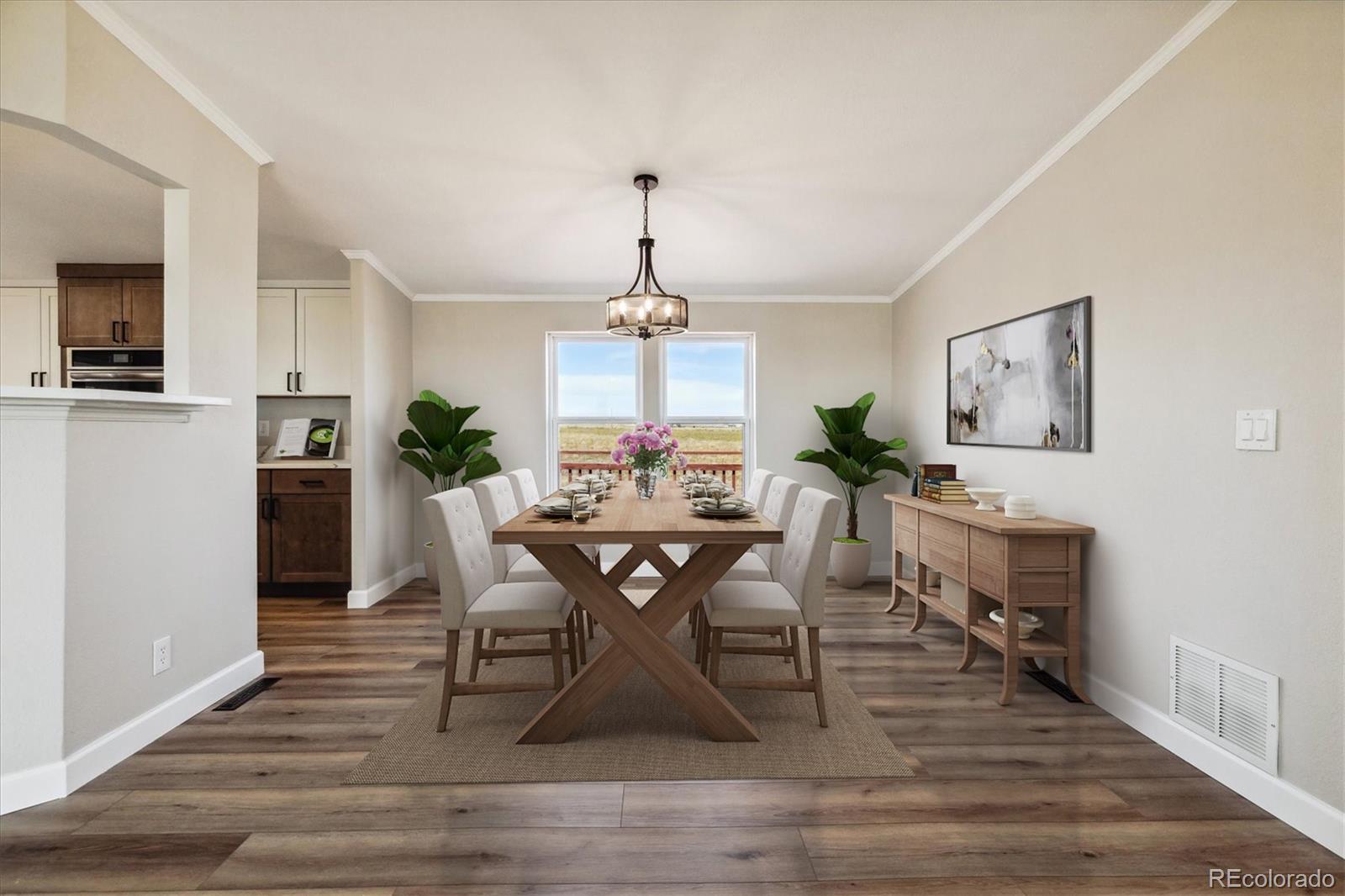 a view of a dining room with furniture and wooden floor