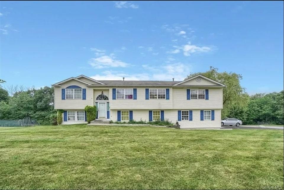 View of front of home featuring a front lawn