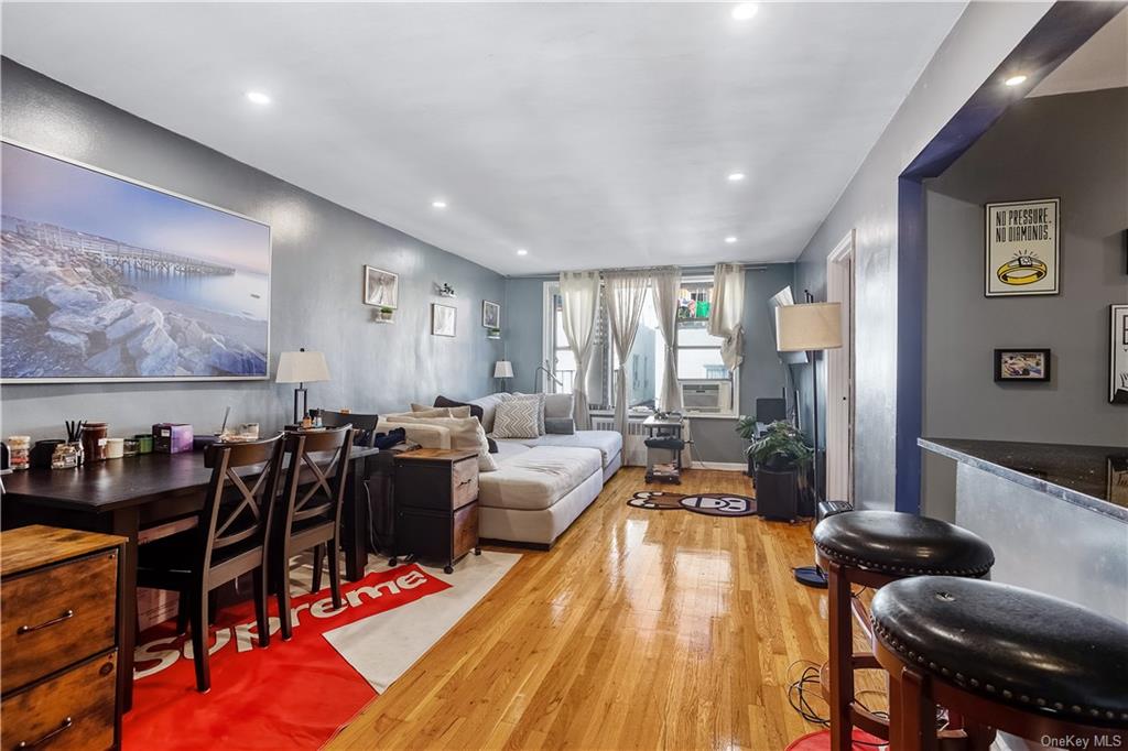 a living room with lots of furniture and wooden floor