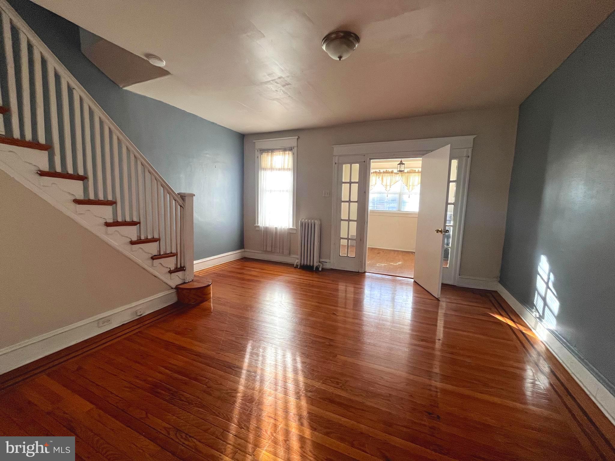 a view of an entryway with wooden floor