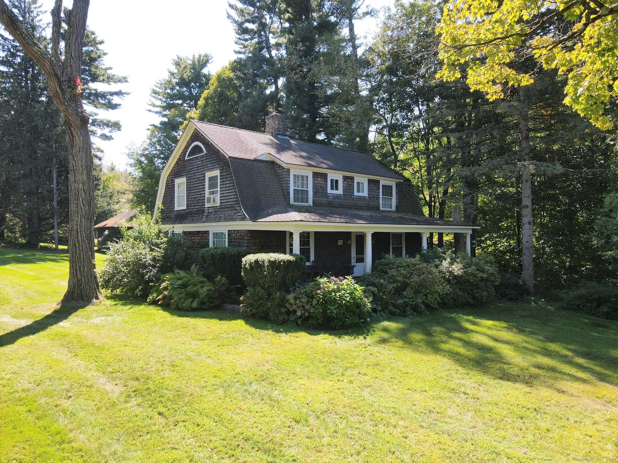 a front view of a house with swimming pool