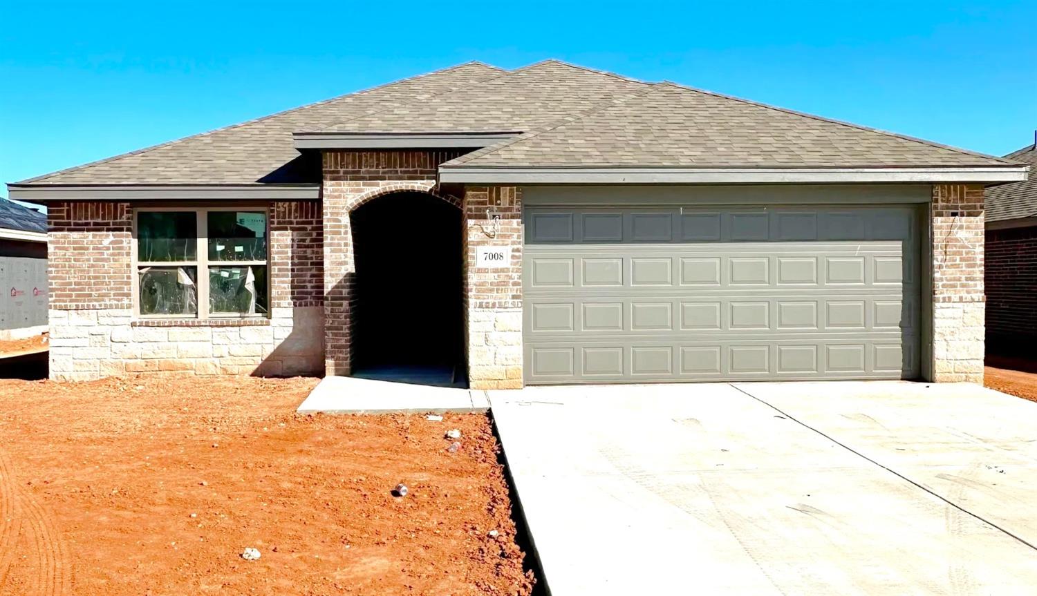 a front view of a house with a garage