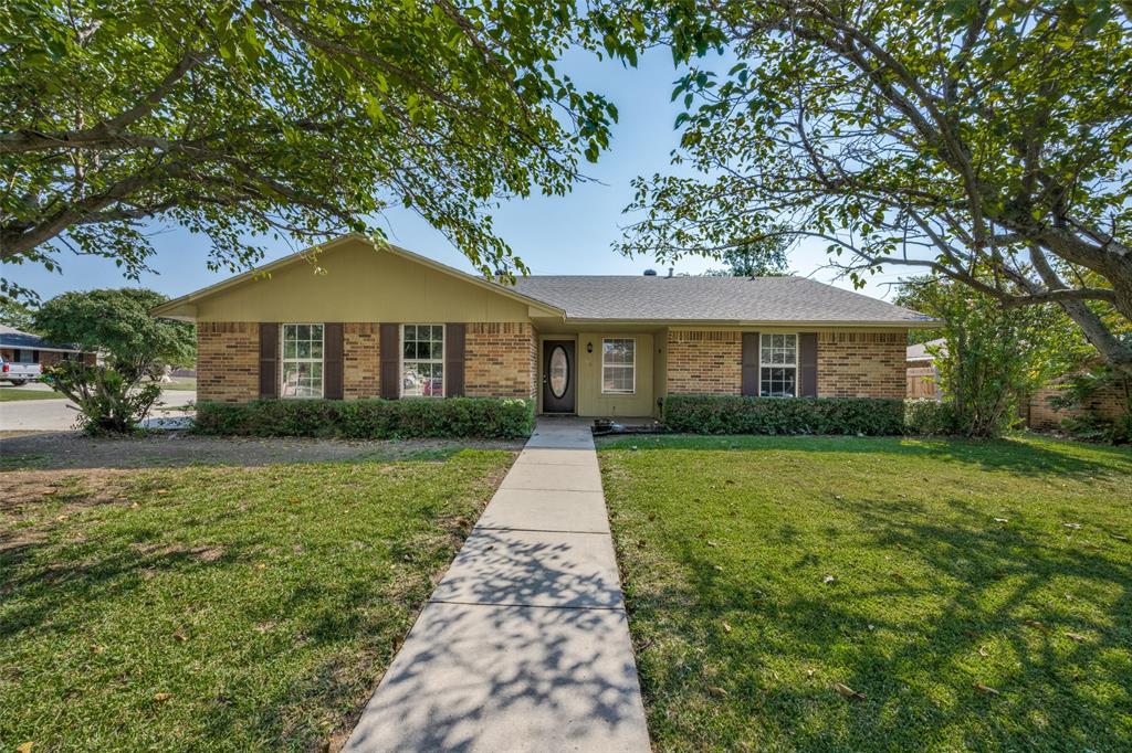 a front view of a house with yard