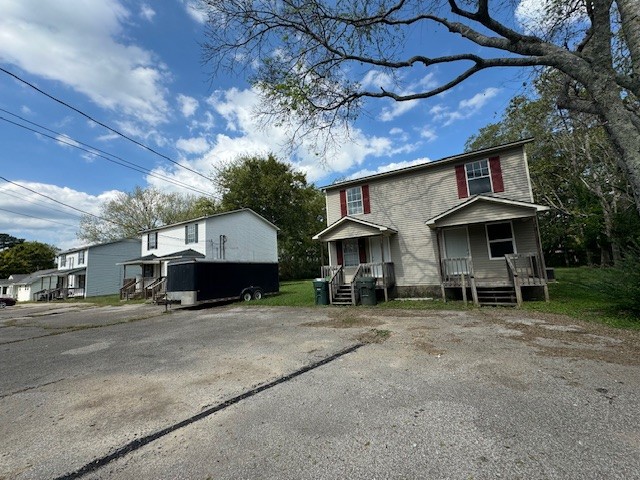 a view of a car park in front of house