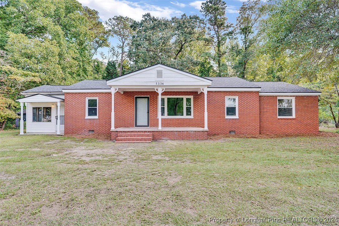 a front view of a house with yard