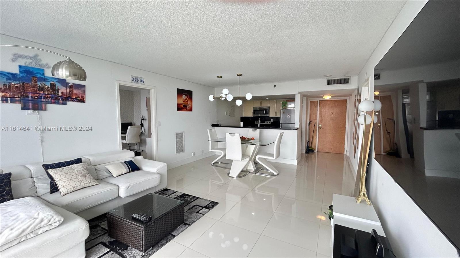 a living room with furniture and a table