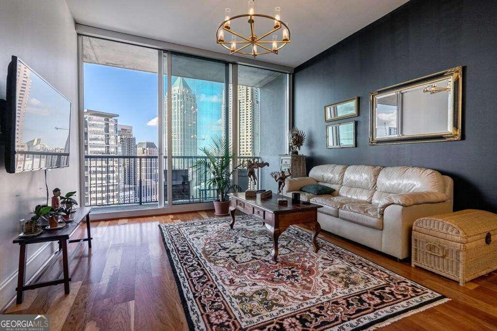 a living room with furniture and a flat screen tv