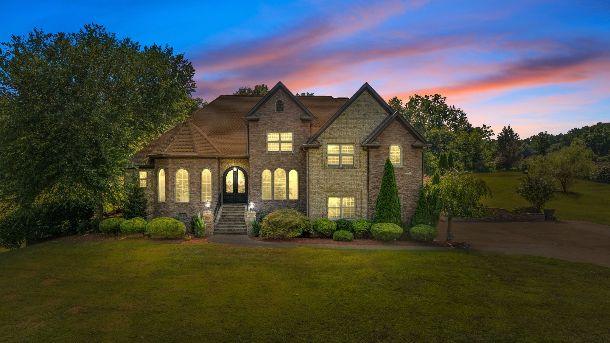 a front view of a house with garden