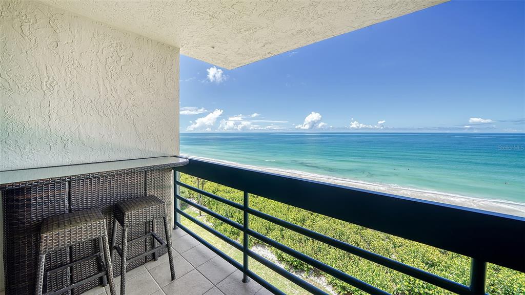 a view of swimming pool from a balcony