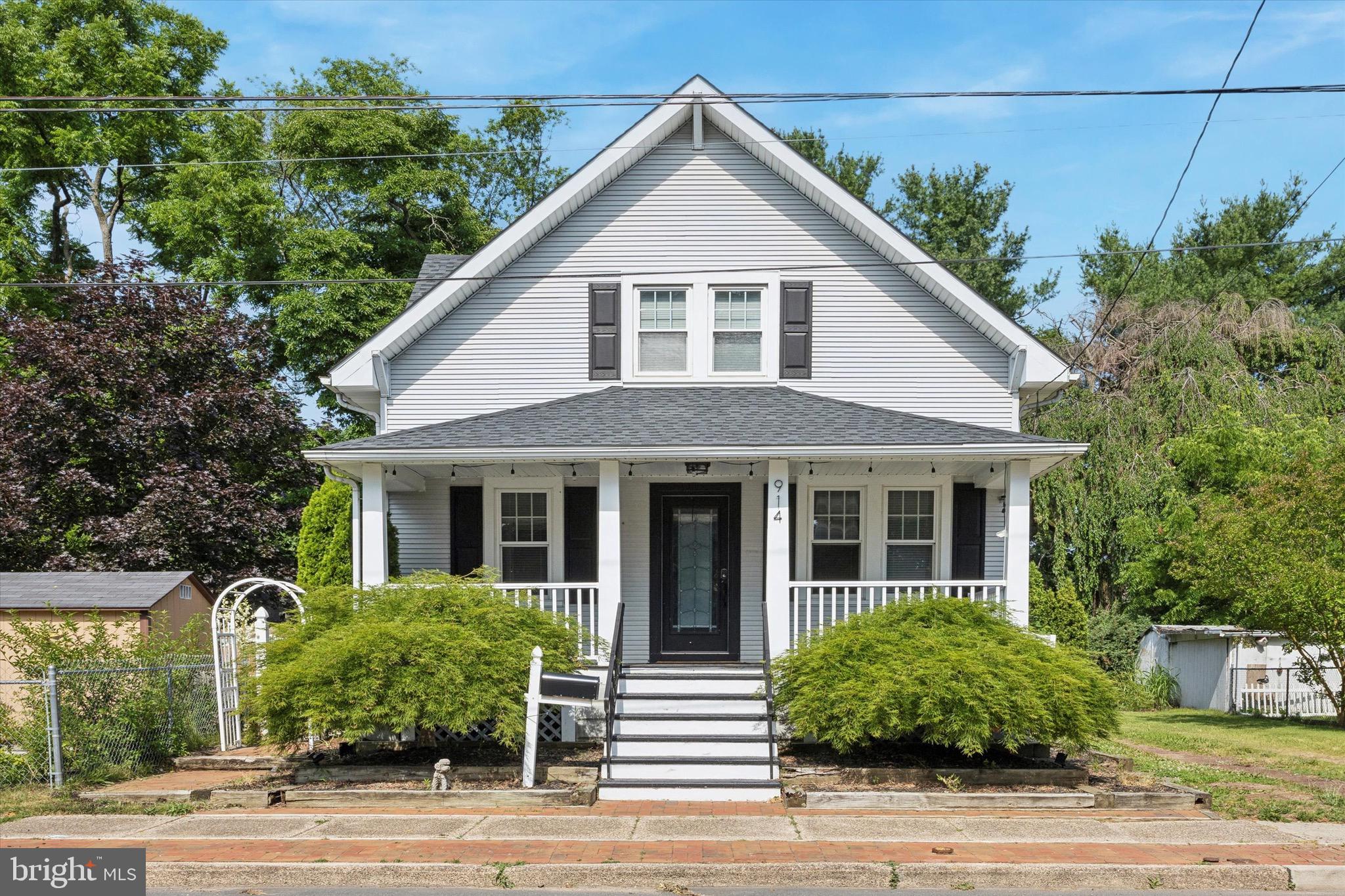 a view of a yard in front view of a house