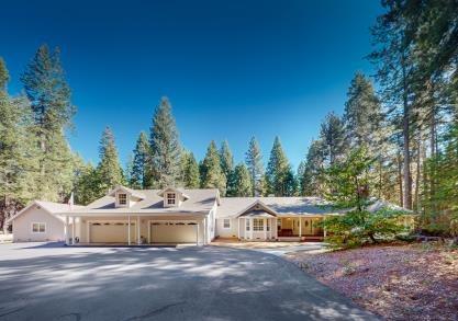 a view of a house with a big yard