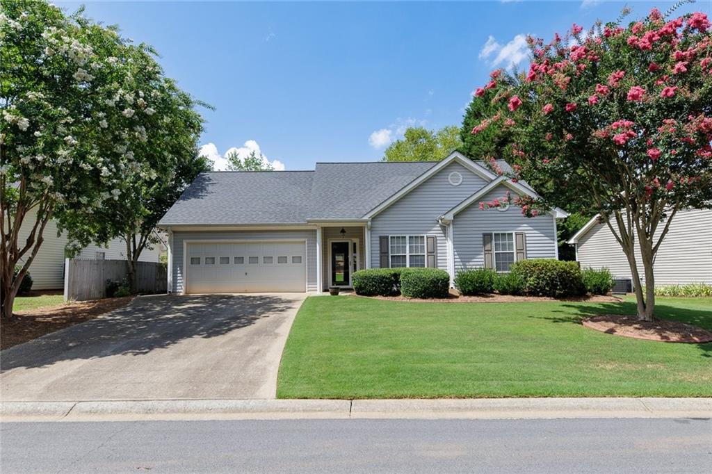 a front view of a house with a yard