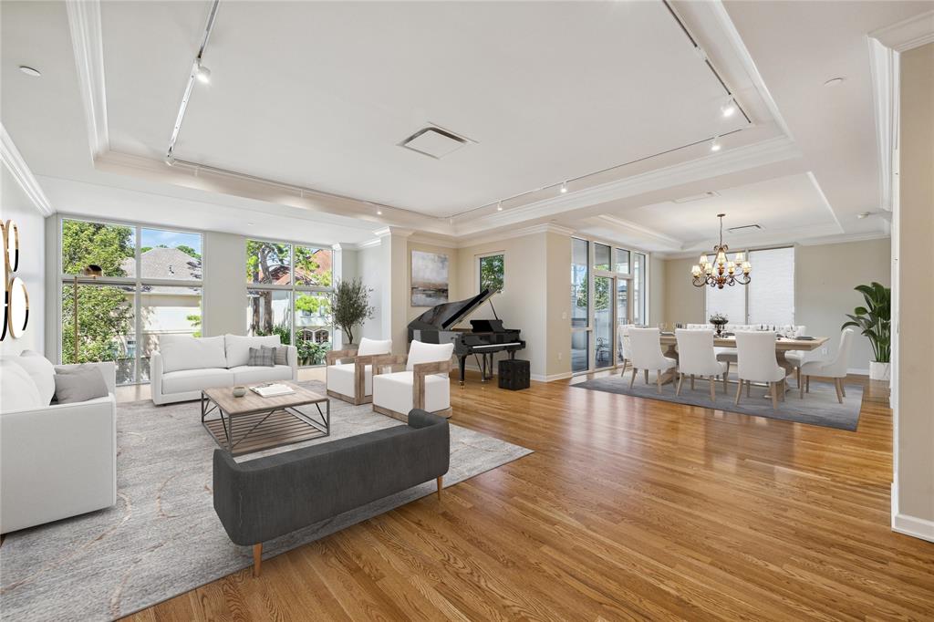 a living room with fireplace furniture and a wooden floor