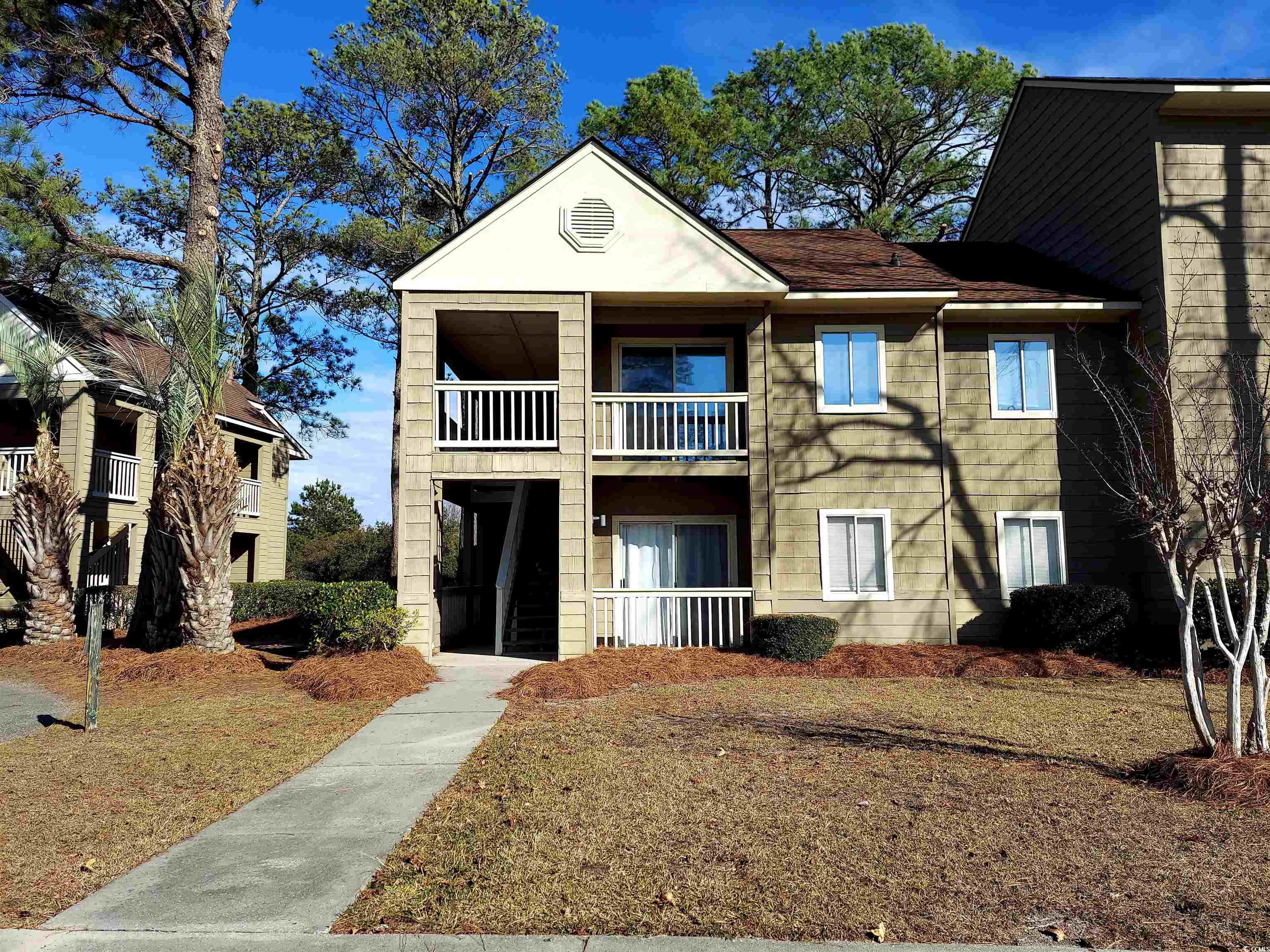 View of front of home with a balcony