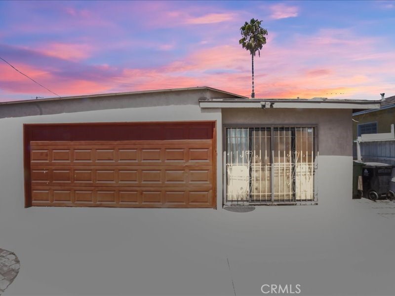 a front view of a house with a garage