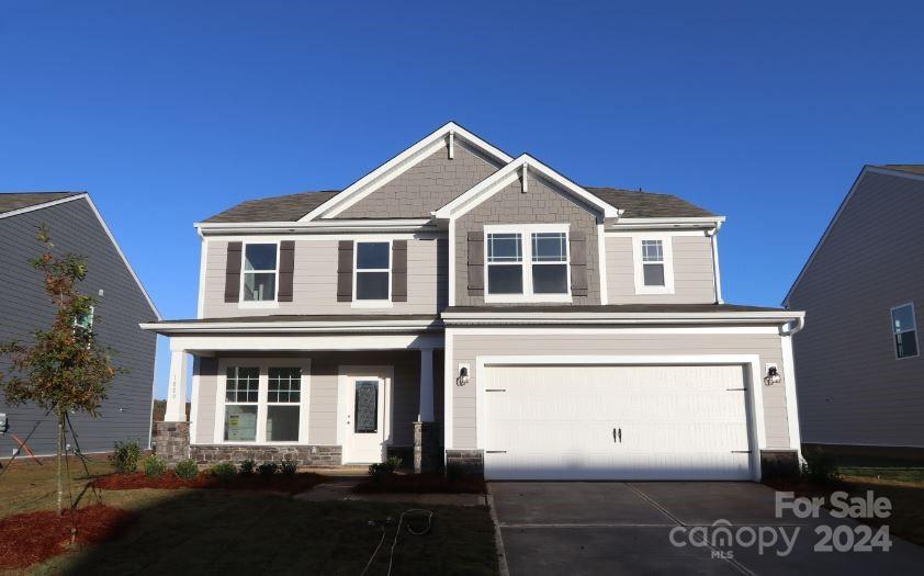 a front view of a house with yard