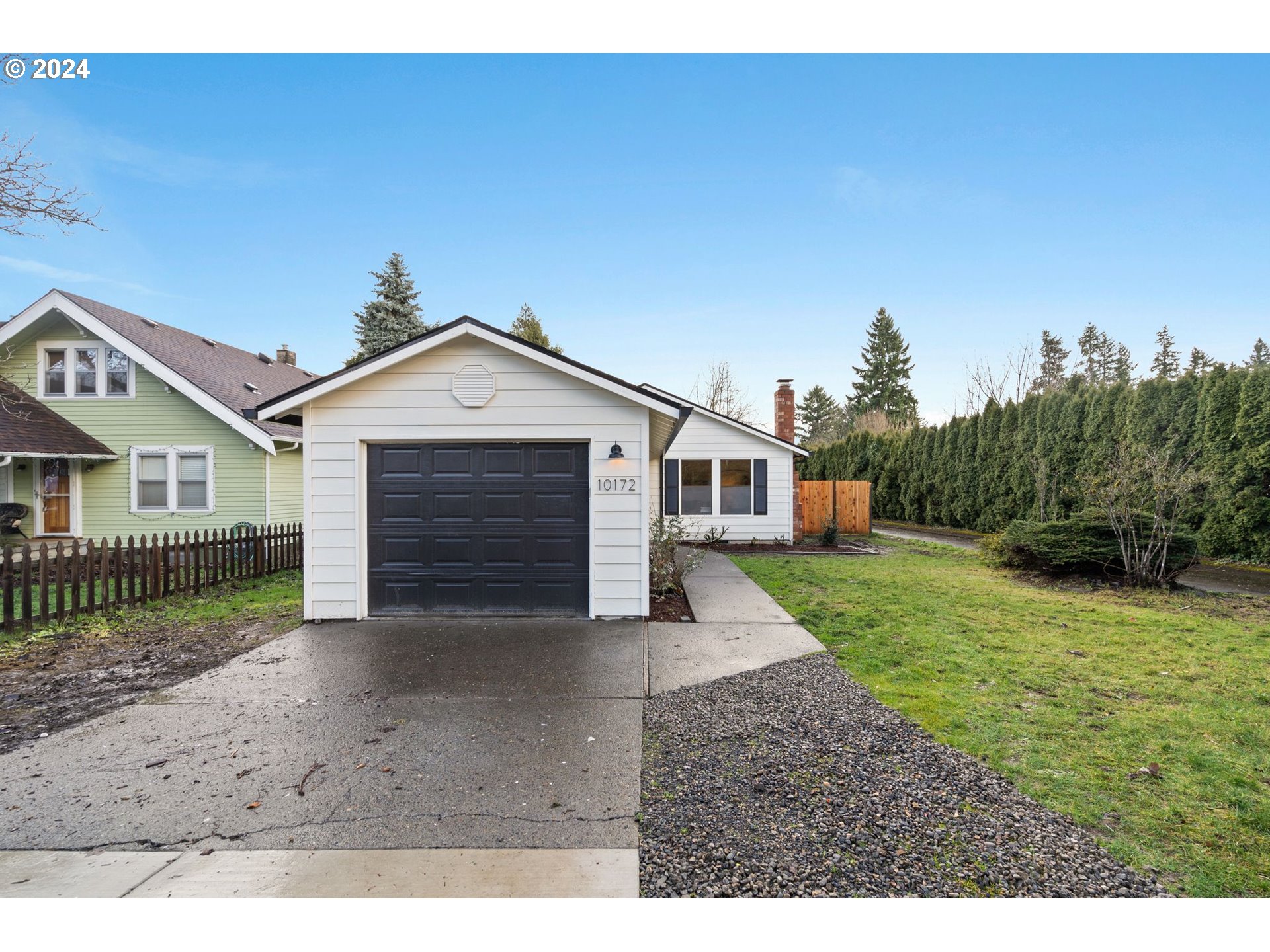 a view of a house with a yard