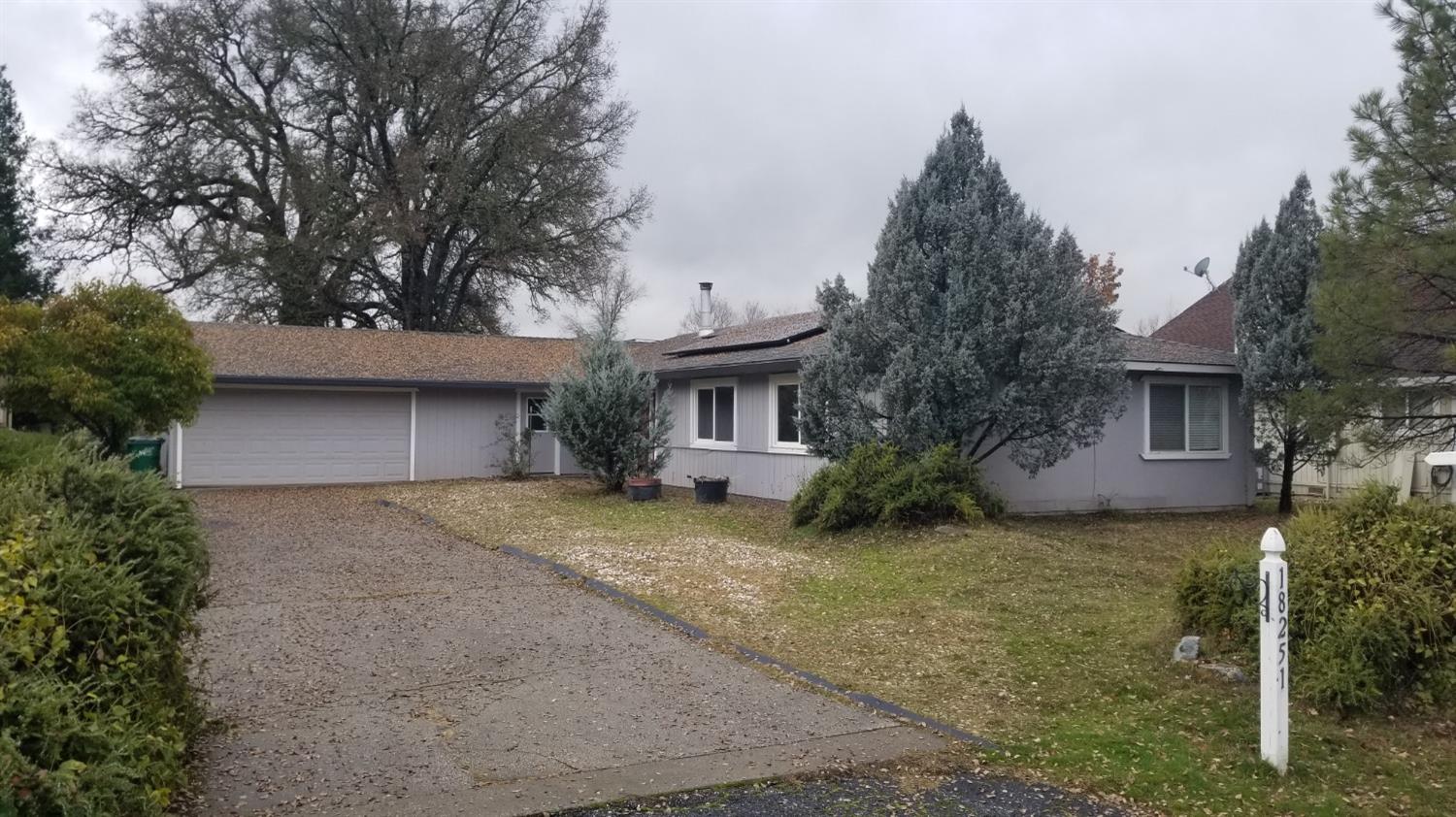 front view of a house with a trees