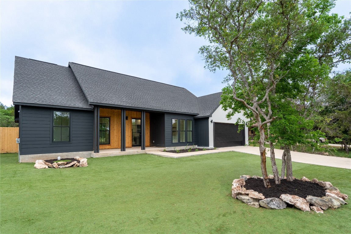 a front view of a house with a yard