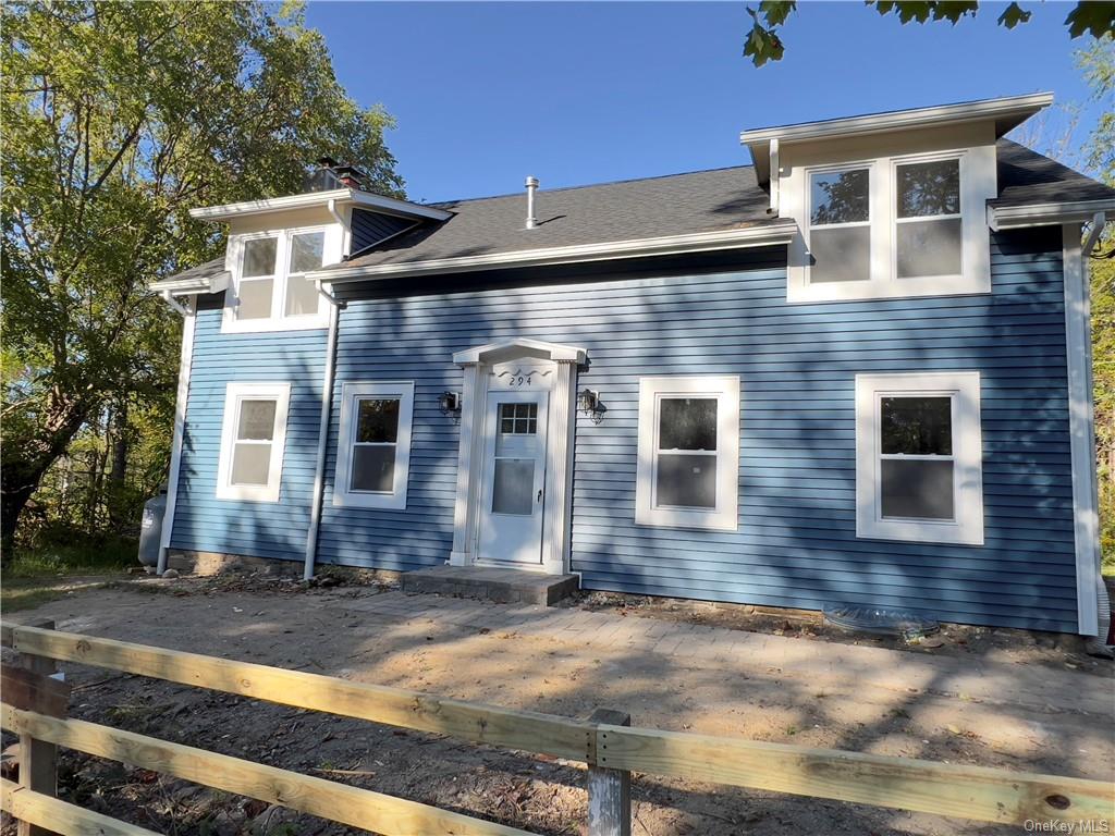 a front view of a house with yard