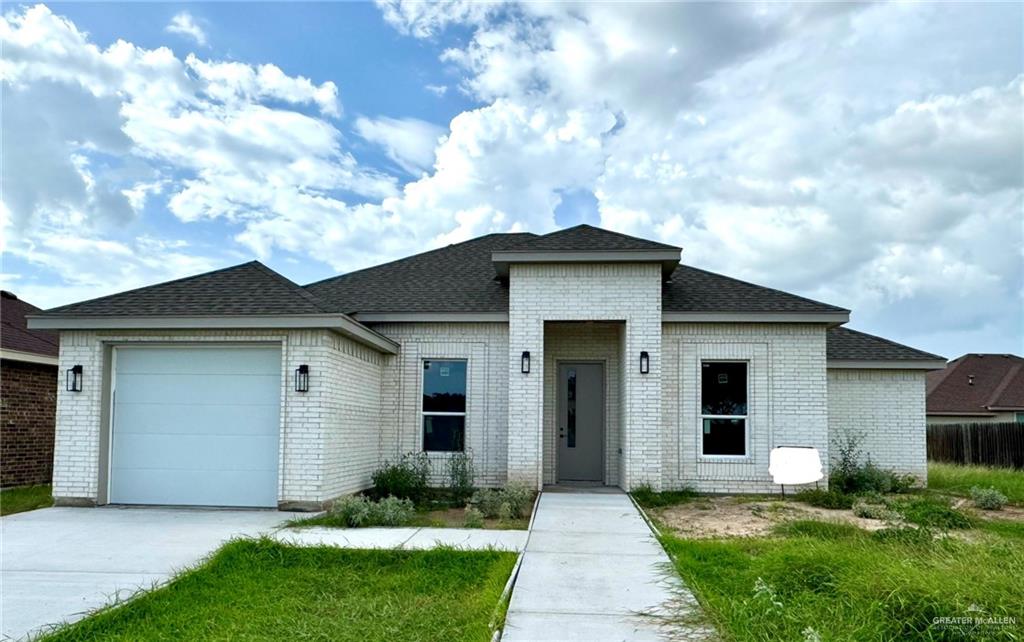 View of front of home featuring a garage