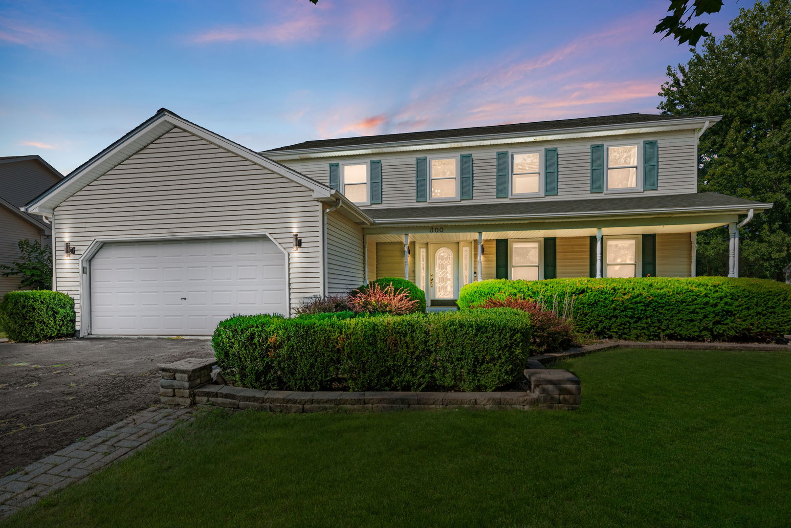 front view of a house with a yard