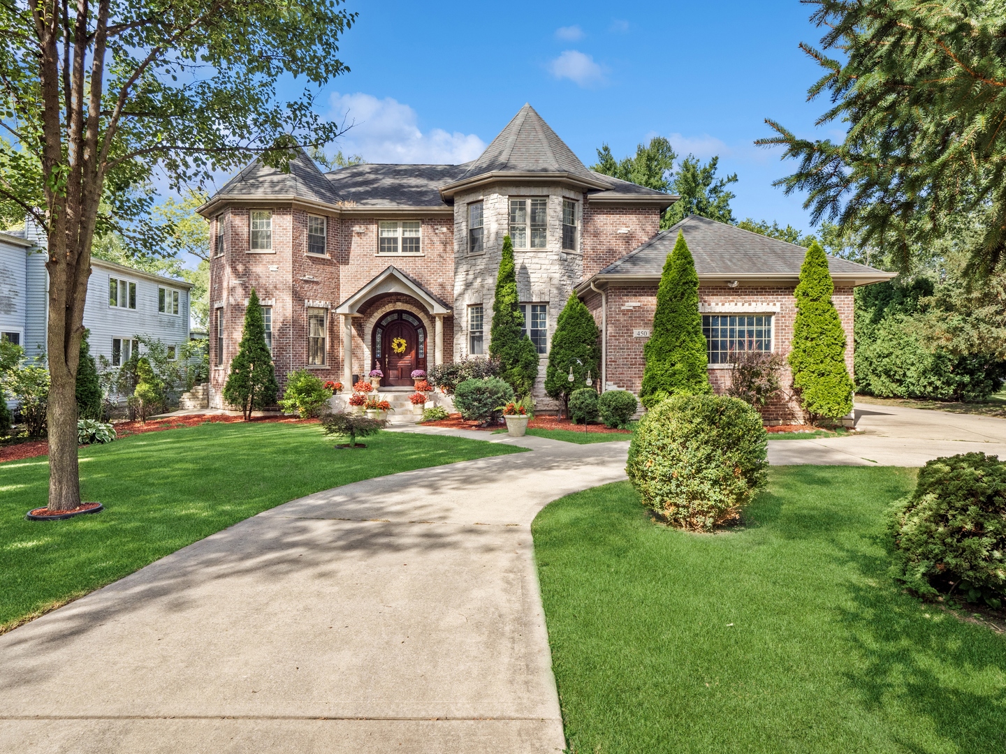 a front view of a house with a yard