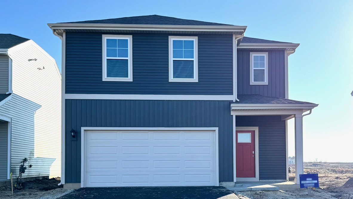 a front view of a house with a garage