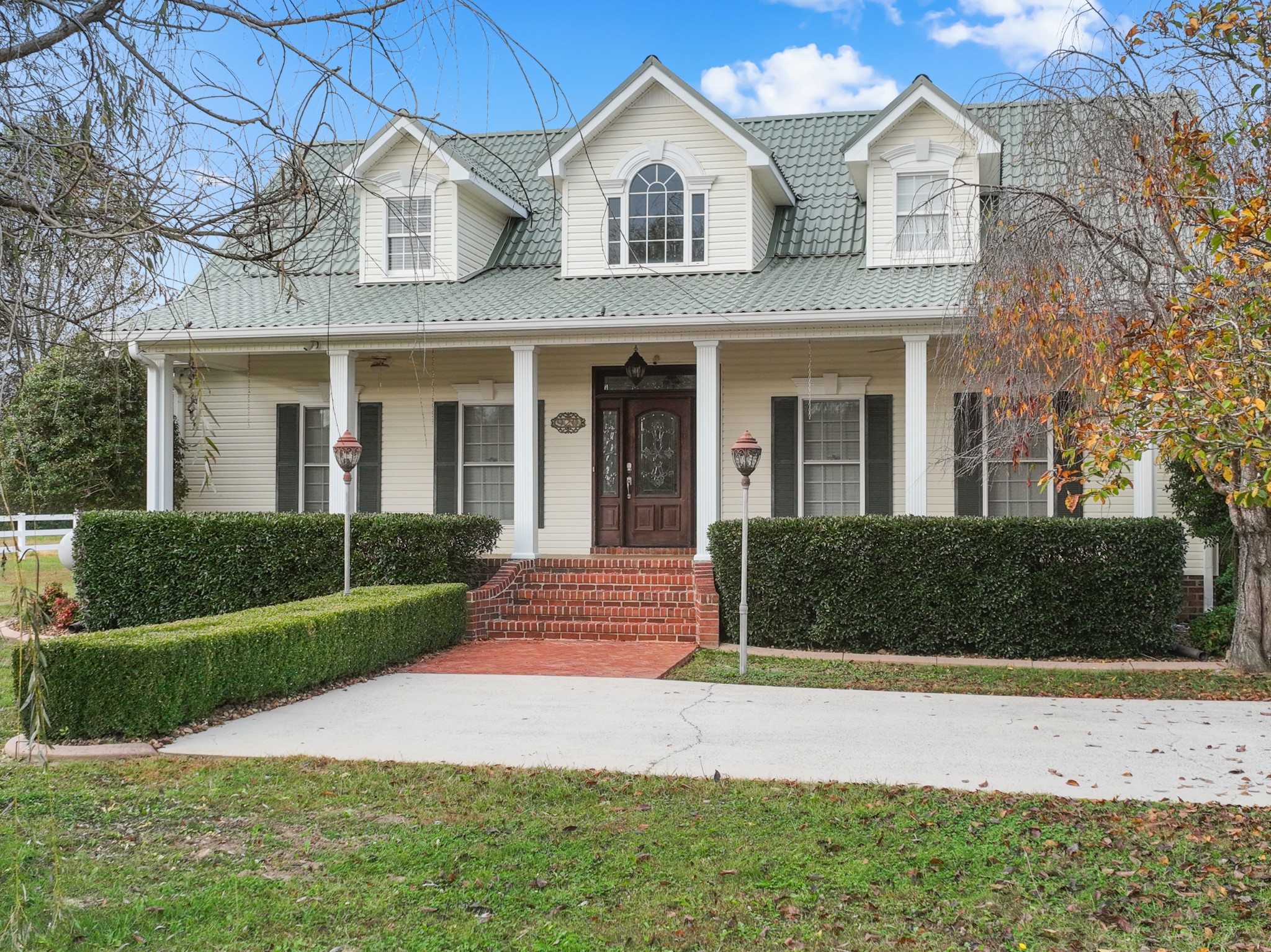 a front view of a house with a yard