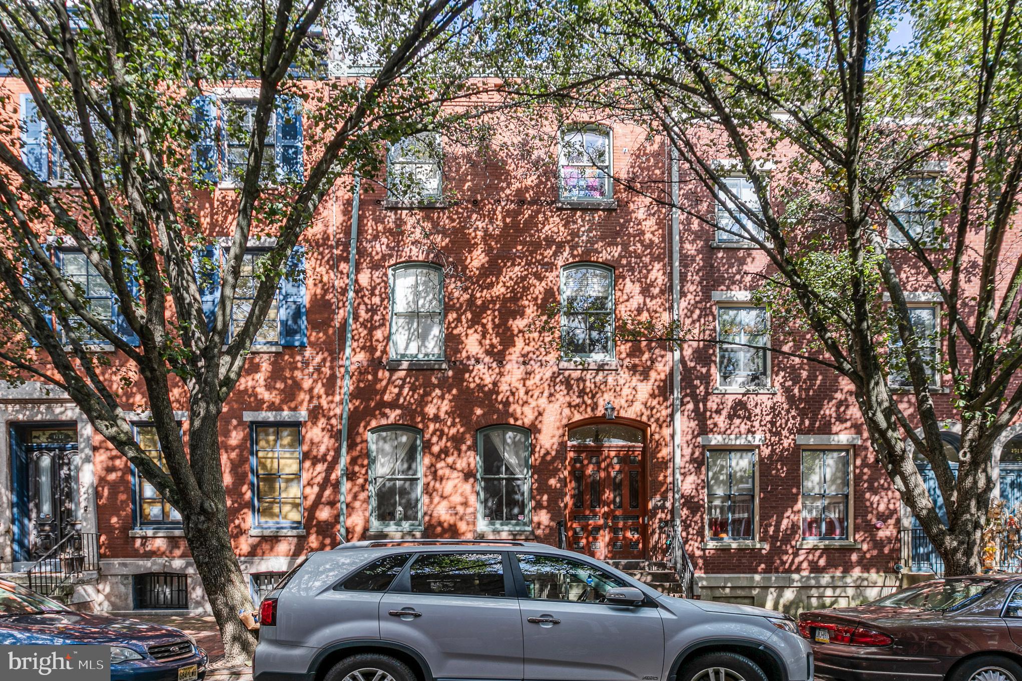 a view of cars parked on a city street