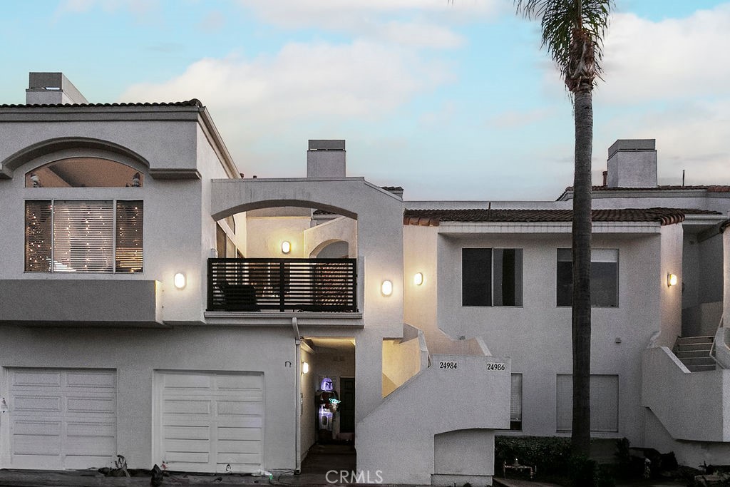 a front view of a house with a garage