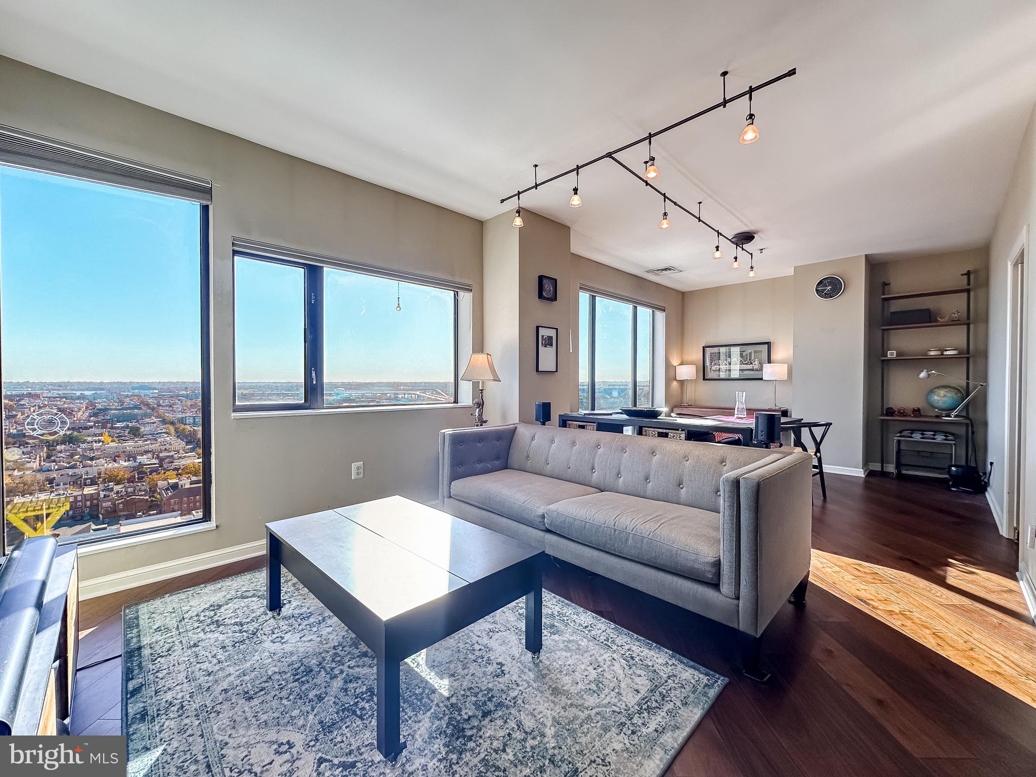 a living room with furniture and a large window