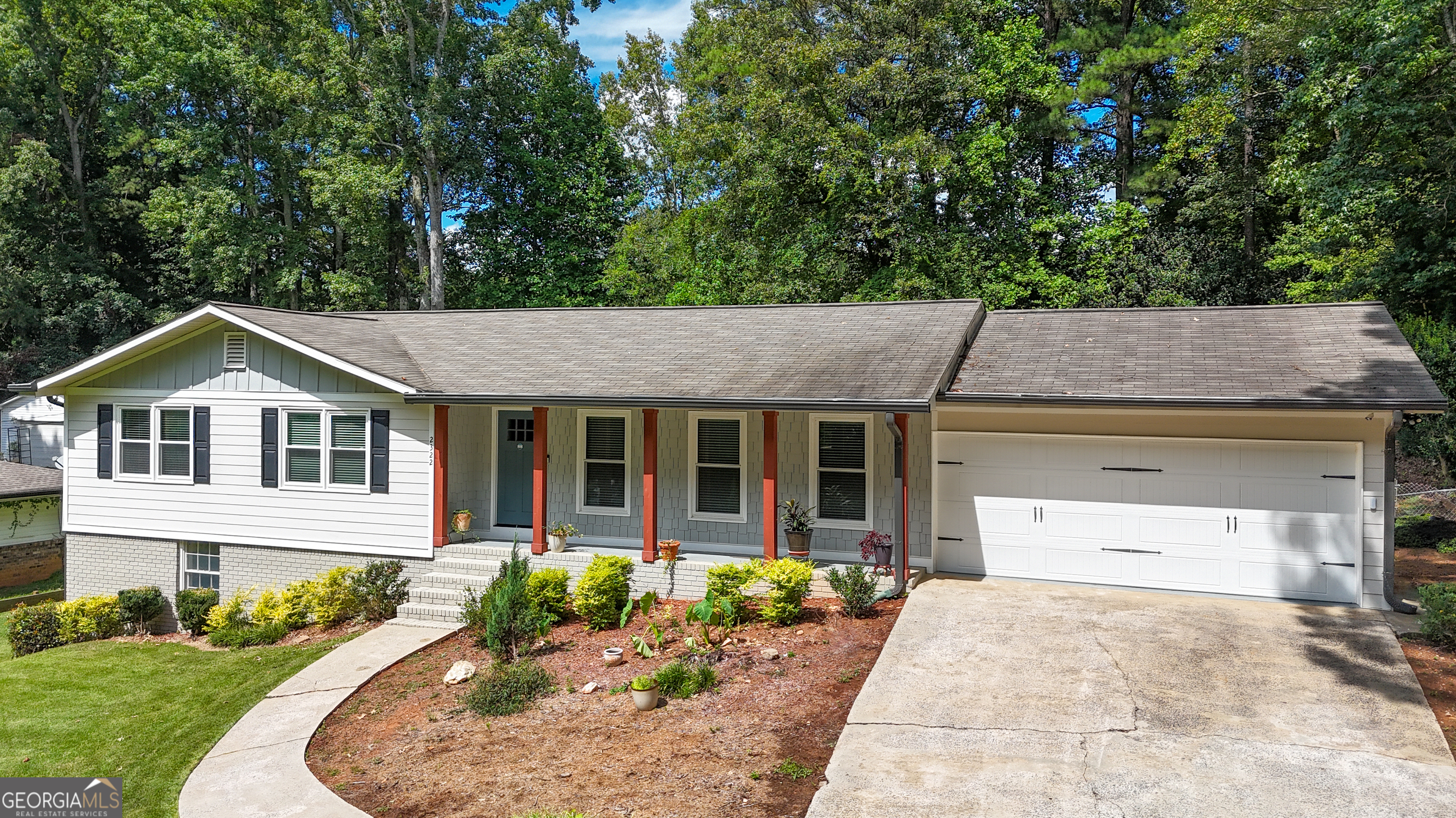 front view of a house with a yard