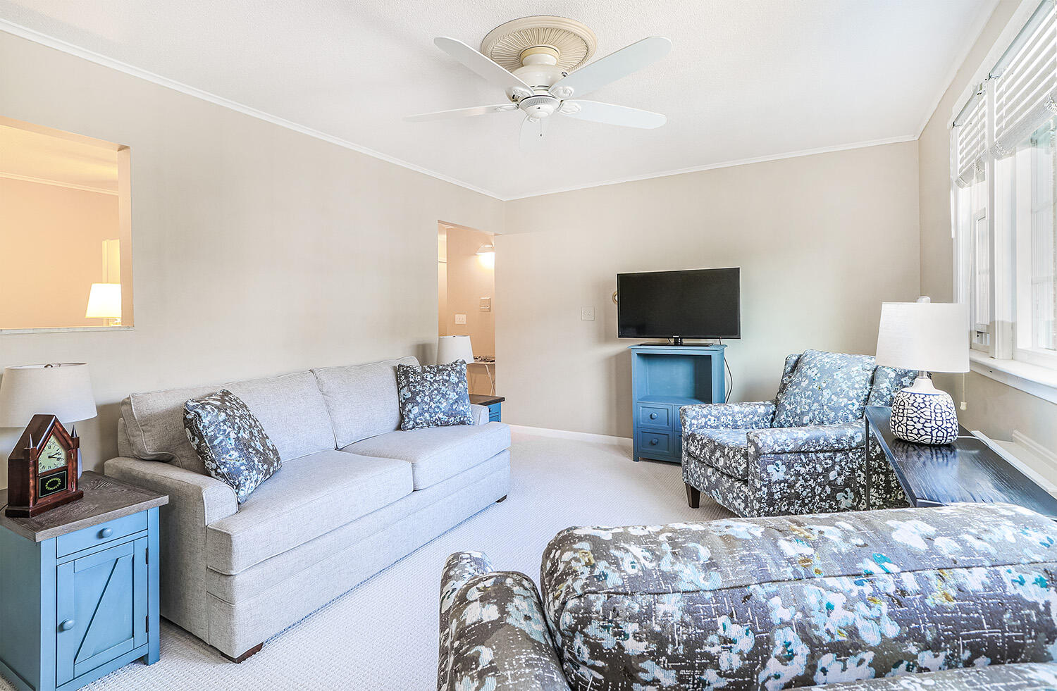 a living room with furniture and a flat screen tv