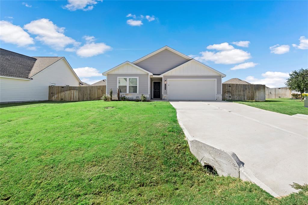 a front view of a house with yard