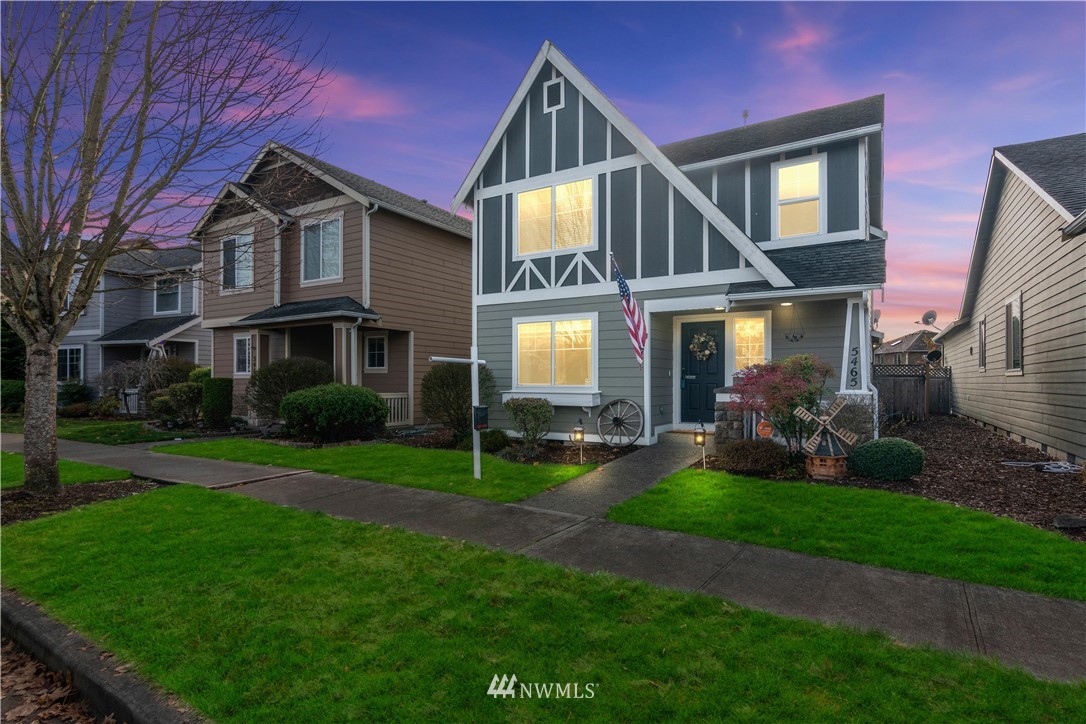 a front view of a house with a yard