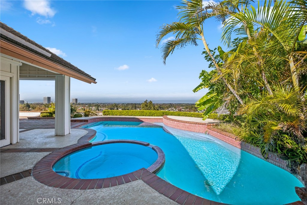 a view of a swimming pool with an outdoor seating