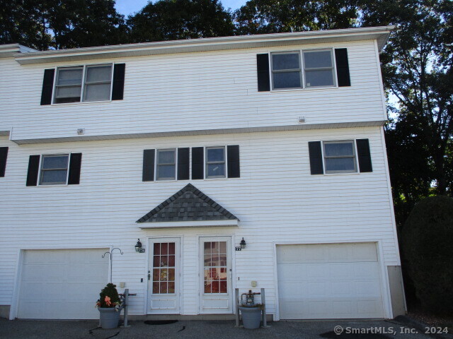 a front view of a house with yard