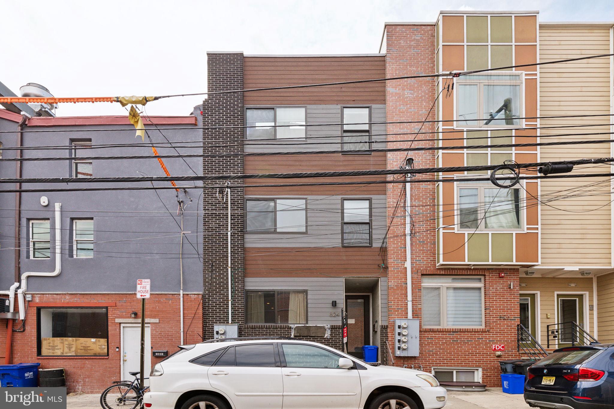 a front view of a building with parking space