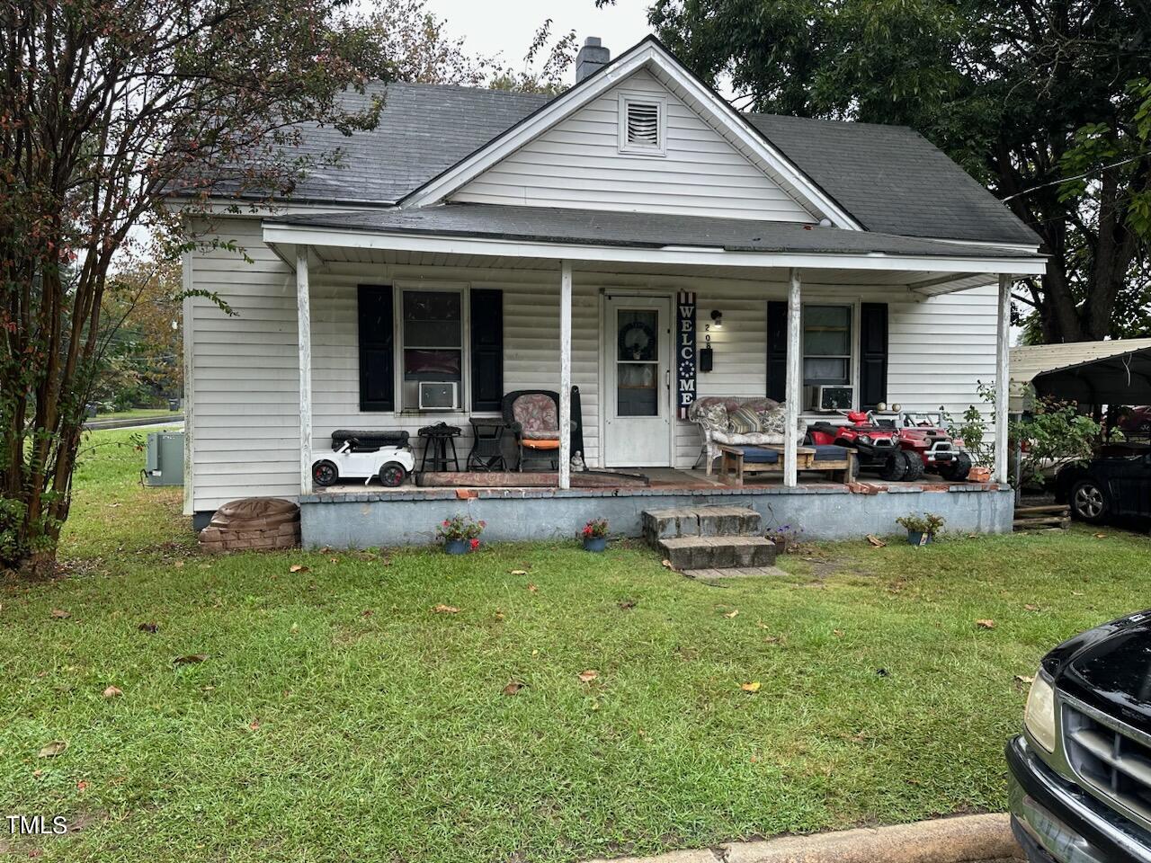 a front view of house with yard patio and green space