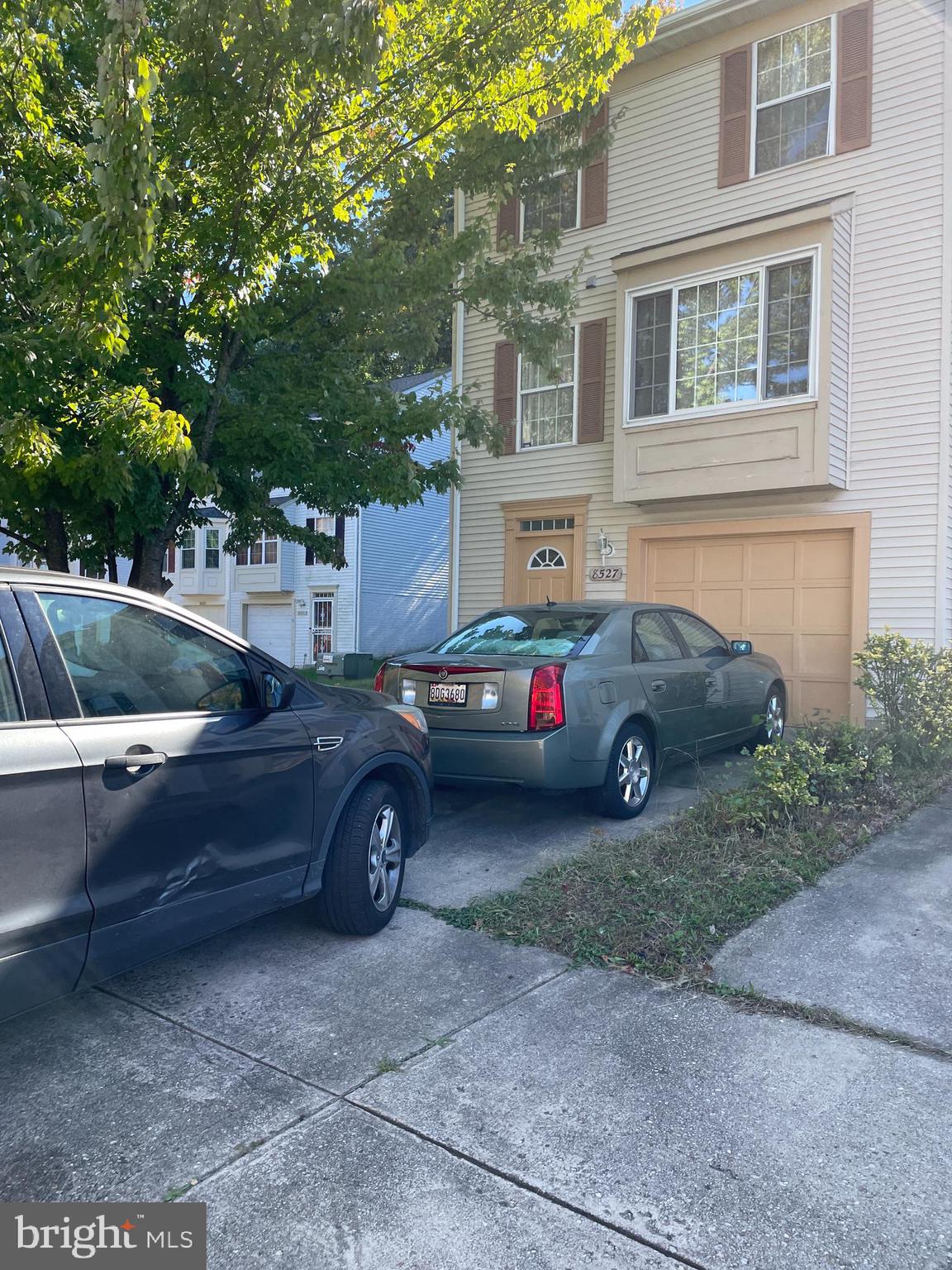 a car parked in front of a house