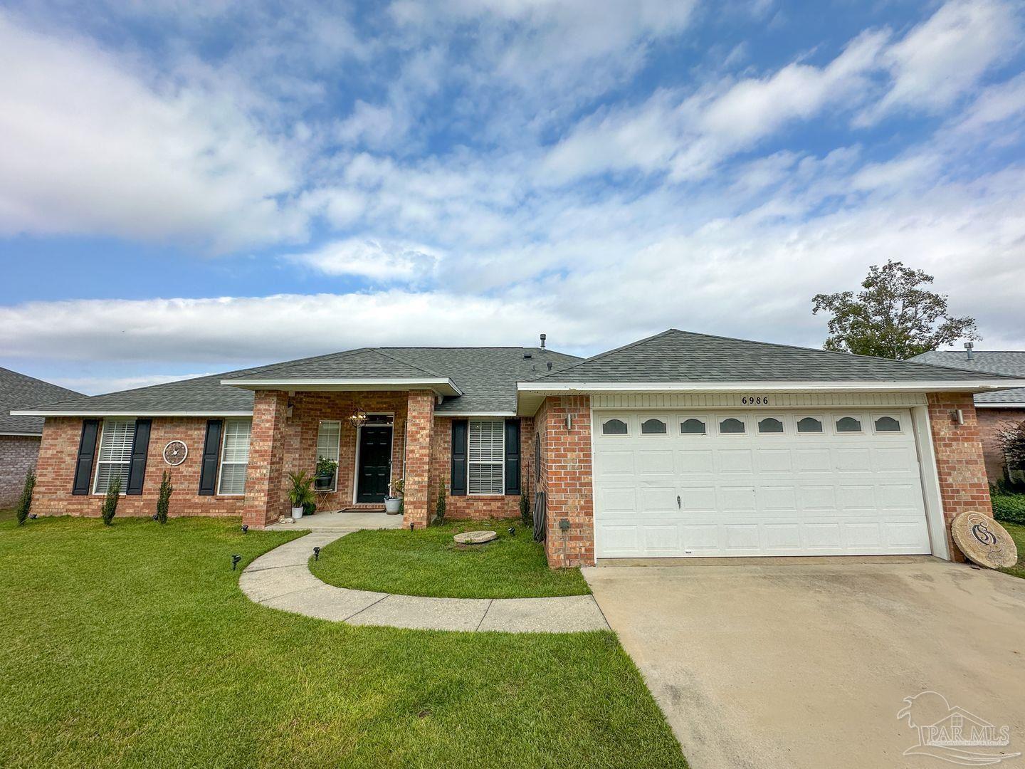 front view of a house with a yard