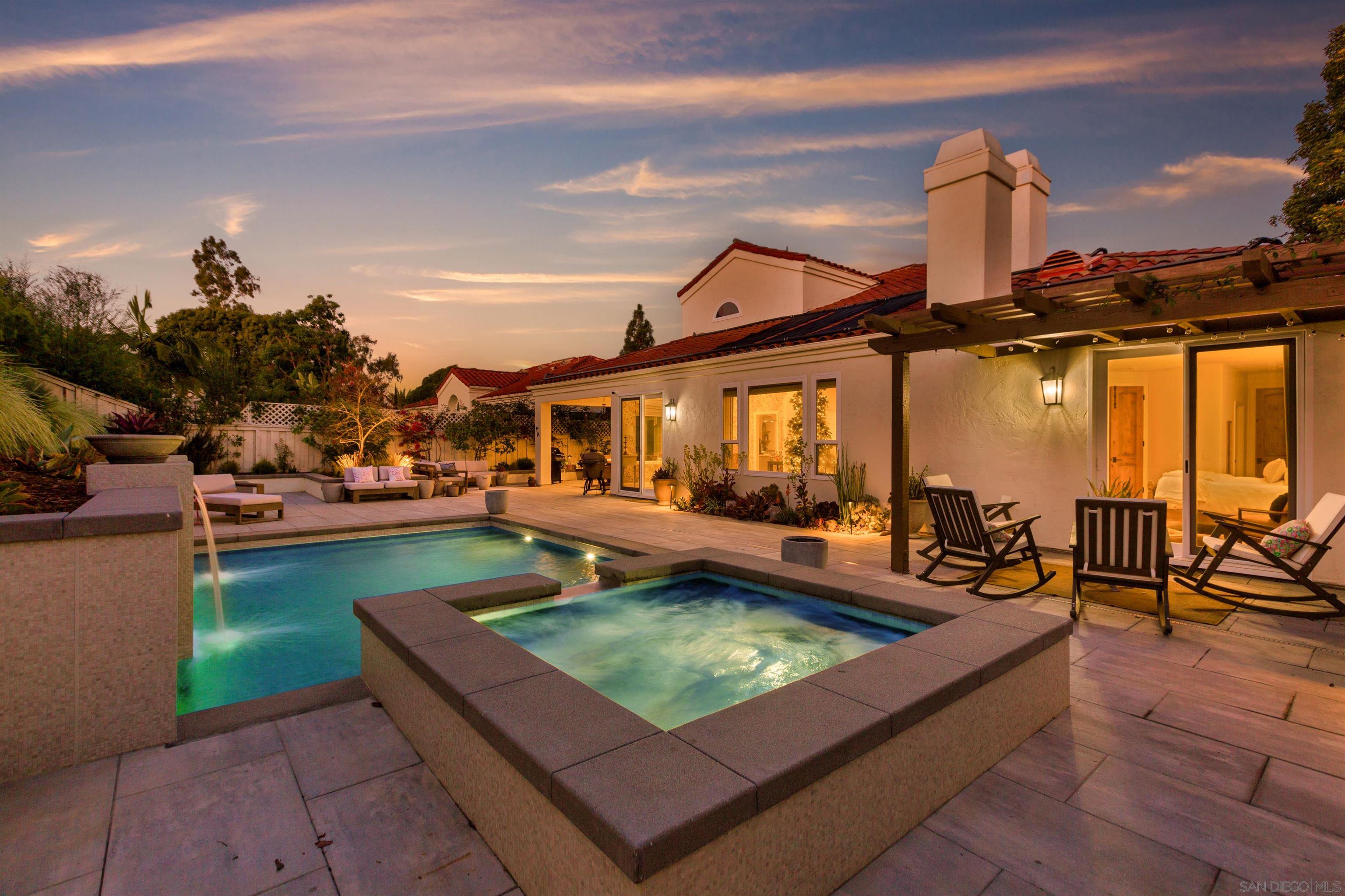 a view of a swimming pool with a patio