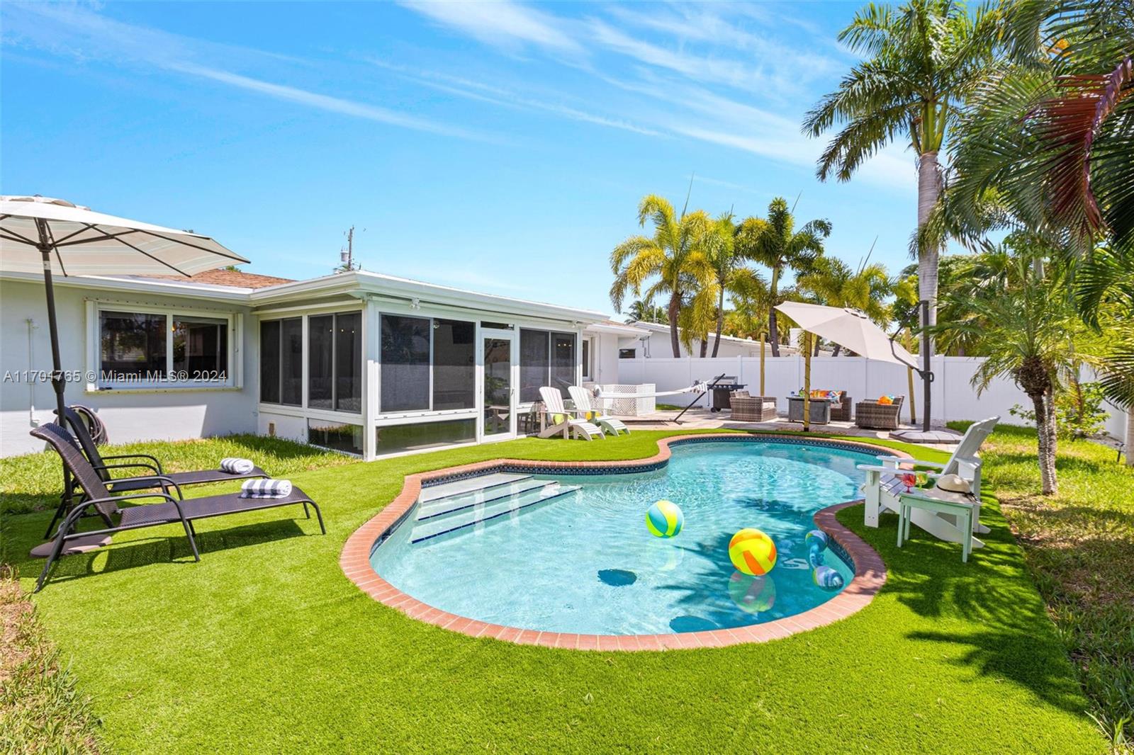 a view of an swimming pool and lounge chair