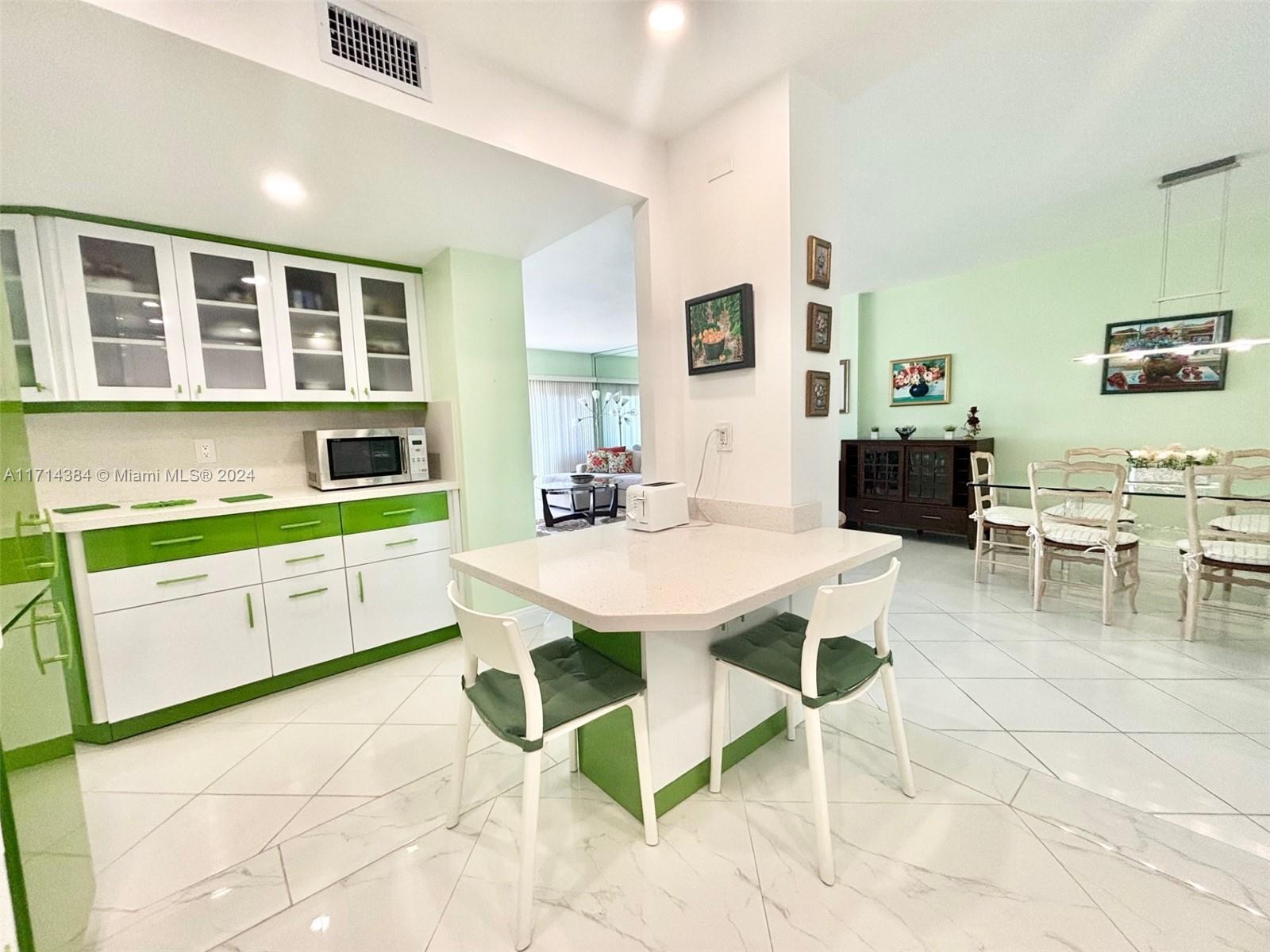 a view of kitchen with breakfast area