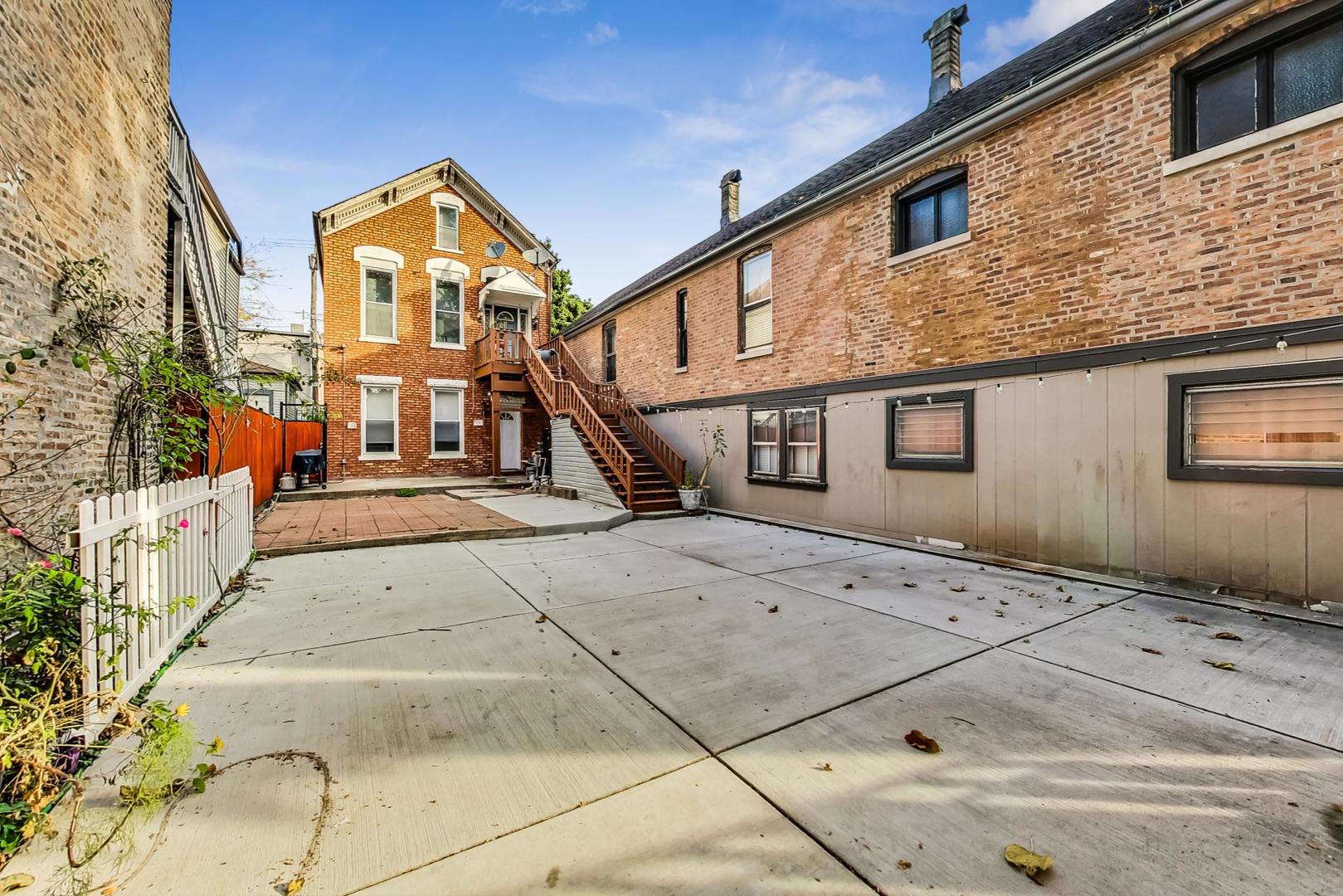 a view of a house with a street